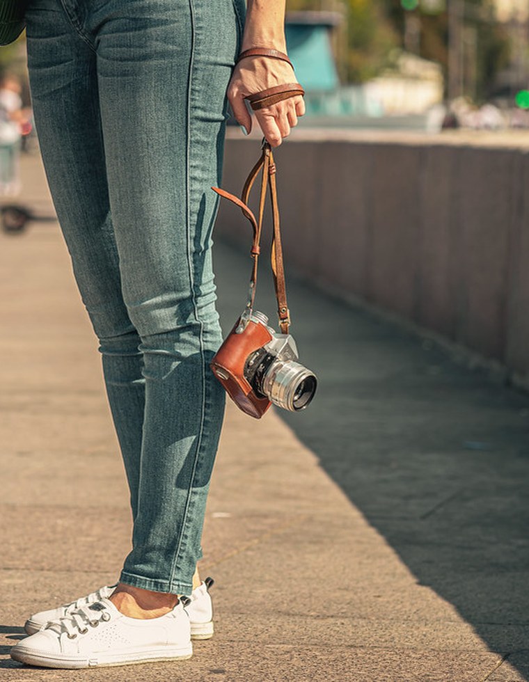 Real photograph of a person holding a camera